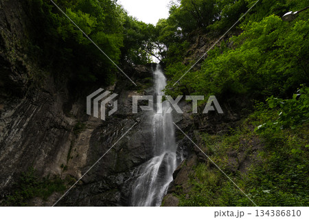 Mountain waterfall in Georgia. a weak waterfall in the mountains Mountain waterfall in Georgia. a weak waterfall in the mountains 134386810