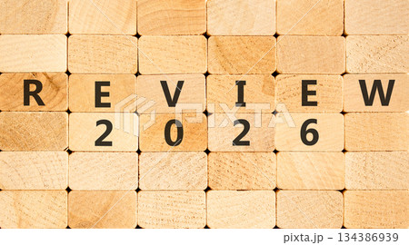 Review 2026 symbol. Concept words Review 2026 on beautiful wooden blocks wall. Beautiful wooden blocks wall background. Business and review 2026 concept. Copy space. Review 2026 symbol. Concept words Review 2026 on beautiful wooden blocks wall. Beautiful wooden blocks wall background. Business and review 2026 concept. Copy space. 134386939