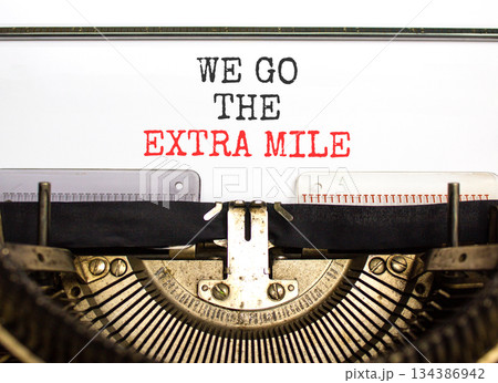Support, help we go the extra mile symbol. Concept words We go the extra mile typed on beautiful old retro typewriter. Beautiful white background. Business we go the extra mile concept. Copy space. Support, help we go the extra mile symbol. Concept words We go the extra mile typed on beautiful old retro typewriter. Beautiful white background. Business we go the extra mile concept. Copy space. 134386942
