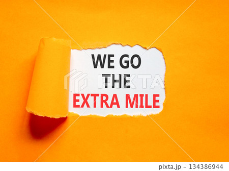 Support, help we go the extra mile symbol. Concept words We go the extra mile on beautiful white paper. Beautiful orange paper background. Business we go the extra mile concept. Copy space. Support, help we go the extra mile symbol. Concept words We go the extra mile on beautiful white paper. Beautiful orange paper background. Business we go the extra mile concept. Copy space. 134386944