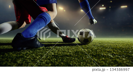 Fast football sprint of two players chase for ball 134386997