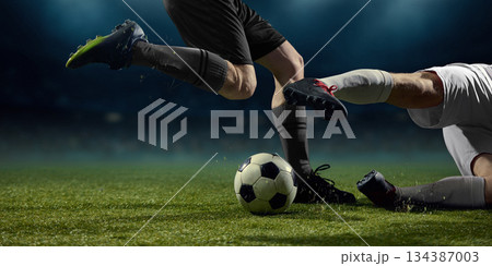 Football boots and ball interaction during close range duel Football boots and ball interaction during close range duel 134387003