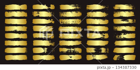 Golden brush strokes, lines, ink smudges, hand-drawn scribble shapes. Handmade sketchy marks, acrylic stains, charcoal streaks. Paint textures, dry brush effect. Marker underline. Vector illustration 134387330
