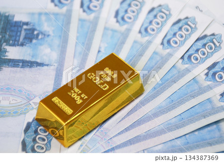 Russian rubles with a gold ingot. Russian financial system backed by gold Russian rubles with a gold ingot. Russian financial system backed by gold 134387369