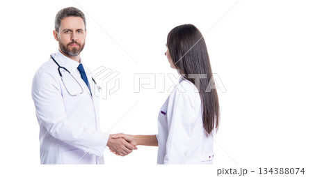 doctor handshake with nurse. healthcare insurance deal. medicine and healthcare. medical deal between two colleague isolated on white. promotion deal in medicine. Handshake deal 134388074