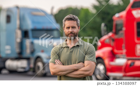 Transportation vehicles. Semi trucks vehicle. Hispanic man trucker. Handsome man driver in front of truck. Trucking owner. Truck driver. Man trucker driver near lorry truck. Trucking company 134388097