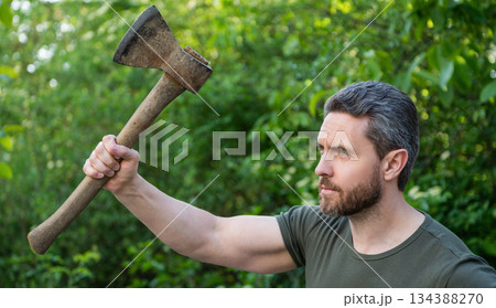 photo of man hit with ax outside. man hit with ax. man hit with ax wearing shirt. man hit with ax photo of man hit with ax outside. man hit with ax. man hit with ax wearing shirt. man hit with ax 134388270