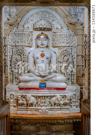 India, Interior of a Jain temple, marble statue of a Jain figure, Tirthankara, seated in meditation posture, lotusIndia, 134388671