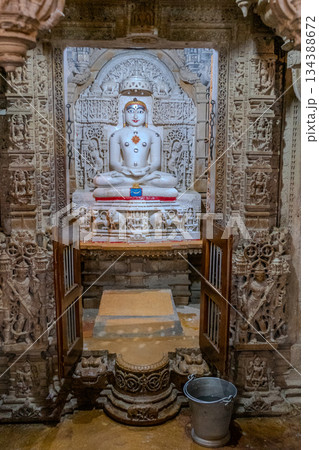 India, Interior of a Jain temple, marble statue of a Jain figure, Tirthankara, seated in meditation posture, lotusIndia, 134388672