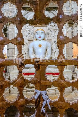 India, Interior of a Jain temple, marble statue of a Jain figure, Tirthankara, seated in meditation posture, lotusIndia, India, Interior of a Jain temple, marble statue of a Jain figure, Tirthankara, seated in meditation posture, lotusIndia, 134388673