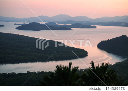 Scenery of islands and river at Khao Fa Chi View Point after the sunset, Ranong, Thailand. Scenery of islands and river at Khao Fa Chi View Point after the sunset, Ranong, Thailand. 134389478