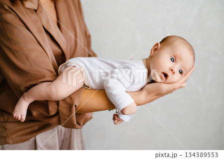 Tender Moment Mother Holding Newborn Tender Moment Mother Holding Newborn 134389553