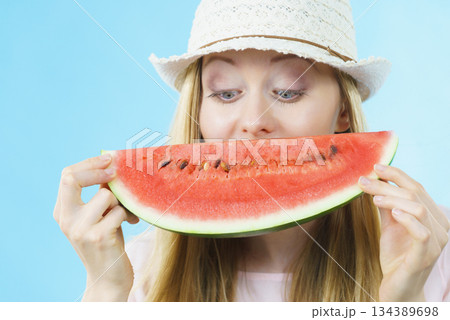 woman holding watermelon fruit 134389698