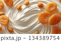 yogurt with dried apricots. yogurt-and-cream texture. aesthetic appearance 134389754