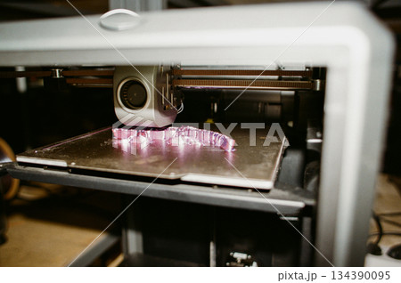 printing of three-dimensional plastic toys at factory with 3D printers. printing of three-dimensional plastic toys at factory with 3D printers. 134390095