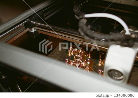 printing of three-dimensional plastic toys at factory with 3D printers. printing of three-dimensional plastic toys at factory with 3D printers. 134390096