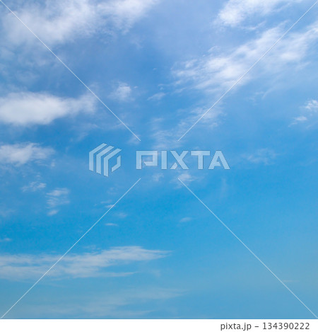 Light Blue Sky Background with Wispy Cirrus and Cumulus Clouds Light Blue Sky Background with Wispy Cirrus and Cumulus Clouds 134390222