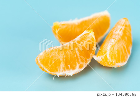 photo of tangerines on a blue background 134390568