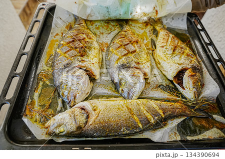 Golden Baked Dorado Fish on Baking Tray Golden Baked Dorado Fish on Baking Tray 134390694