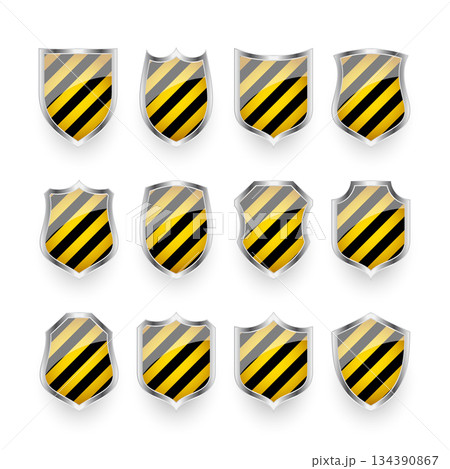 Glossy shields with yellow and black pattern. Security and protection concept. Cyber safety icons, internet privacy, web defense, digital data protection and antivirus themes. Vector illustration 134390867