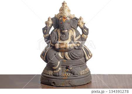 Clay Ganesha idol decorated in gold for Ganesha Chaturthi 134391278