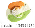 Idli served with tricolor chutney on a white background 134391354