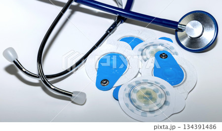 Cardiology healthcare concept with ecg electrodes and stethoscope. Cardiology healthcare concept with ecg electrodes and stethoscope. 134391486