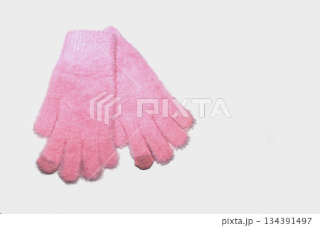 Fuzzy winter gloves for kids on white background. Fuzzy winter gloves for kids on white background. 134391497