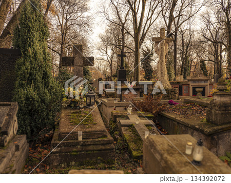 Autumn Cemetery Scene With Mossy Tombstones, Crosses, and Serene Tombs in Quiet Grounds Autumn Cemetery Scene With Mossy Tombstones, Crosses, and Serene Tombs in Quiet Grounds 134392072