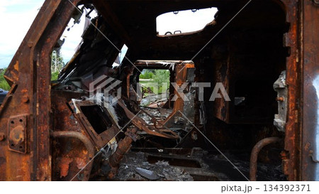 Rusty and burned-out armored vehicles on ukrainian territory. Exhibition of destroyed military equipment of the russian army. War between Ukraine and russia. Close up Slow motion Rusty and burned-out armored vehicles on ukrainian territory. Exhibition of destroyed military equipment of the russian army. War between Ukraine and russia. Close up Slow motion 134392371