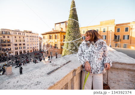 Woman enjoying festive city view in Rome near the Spanish Steps 134392374