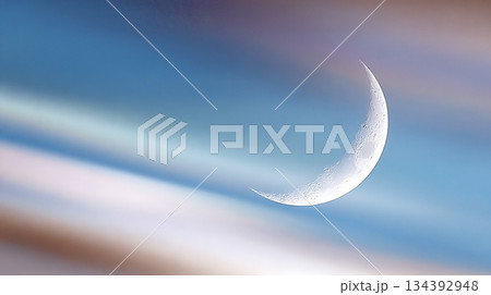 Crescent Moon With Rainbow Aura in the Night Sky Over a Serene Landscape During Twilight Hours Crescent Moon With Rainbow Aura in the Night Sky Over a Serene Landscape During Twilight Hours 134392948