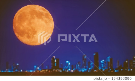 Rising Moon Illuminates Quiet City Skyline During Lunar New Year Celebration at Night 134393090