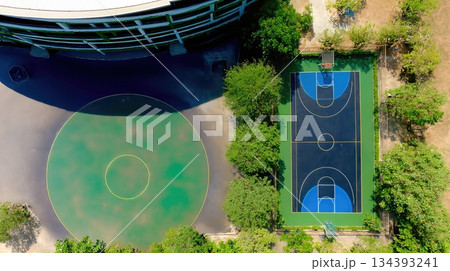 Empty Playground and Basketball Court Show Signs of Neglect in Abandoned Urban Area Empty Playground and Basketball Court Show Signs of Neglect in Abandoned Urban Area 134393241