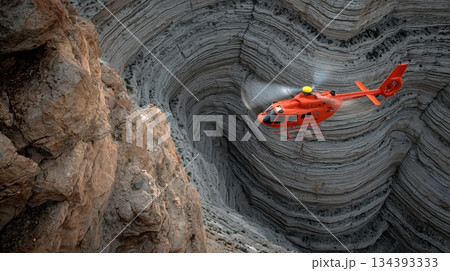 Rescue Helicopter Operates in the Vibrant Grand Canyon Landscape During a Dramatic Rescue Mission 134393333