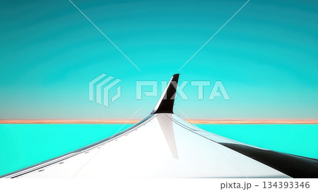 Airplane Wing Extending Over a Clear Turquoise Sky and Distant Horizon at Cruising Altitude 134393346