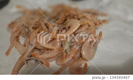 Fresh shrimps piled on surface perfect for seafood cuisine and restaurant menu design 134393487