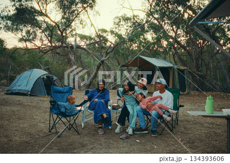 Enjoy a Memorable Family Camping Adventure Surrounded by Nature as the Sunset Approaches 134393606