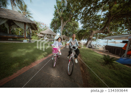 Experiencing Joyful Moments While Riding Bikes on a Beautiful Sunny Day 134393644
