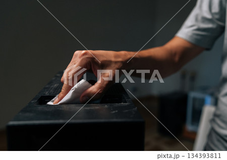 Technician carefully wiping computer case interior, removing dust and grime for maintaining electronic device cleanliness and functionality. Concept of service, repair and cleaning computer. Technician carefully wiping computer case interior, removing dust and grime for maintaining electronic device cleanliness and functionality. Concept of service, repair and cleaning computer. 134393811
