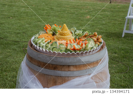 A Bright and Vibrant Vegetable Platter Displayed Beautifully on a Rustic Barrel Table A Bright and Vibrant Vegetable Platter Displayed Beautifully on a Rustic Barrel Table 134394171