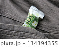 Euro in a jeans pocket. Money for travel and shopping 134394355