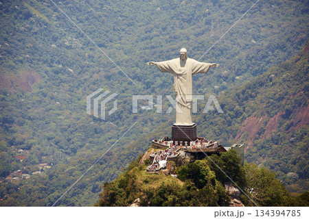 Landscape, monument and Christ the Redeemer statue for tourism, sightseeing and travel destination. Traveling, Rio de Janeiro and aerial view of architecture, sculpture or landmark on Brazil mountain 134394785