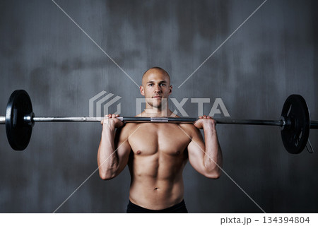 Fitness, portrait man and weightlifting with barbell for bodybuilding, exercise or arm workout at gym. Fit, active or strong muscular bodybuilder male lifting weight for intense strength or training 134394804