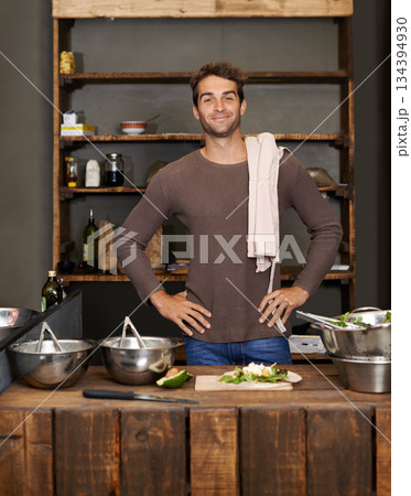 Chef, man akimbo and portrait in kitchen while making delicious food for healthy diet and nutrition. Cooking, confidence and male cook standing in rustic restaurant or small business in Canada. Chef, man akimbo and portrait in kitchen while making delicious food for healthy diet and nutrition. Cooking, confidence and male cook standing in rustic restaurant or small business in Canada. 134394930