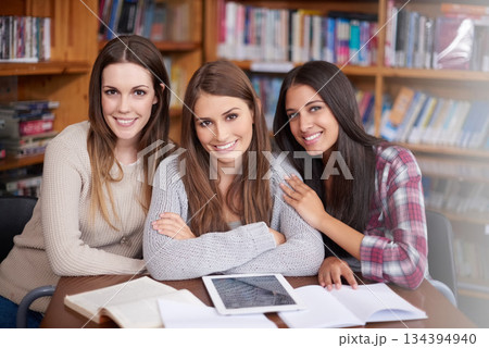 University, education and portrait of women in library for online research, studying and group project. School, learning and happy female students on digital tech for knowledge, internet and website University, education and portrait of women in library for online research, studying and group project. School, learning and happy female students on digital tech for knowledge, internet and website 134394940