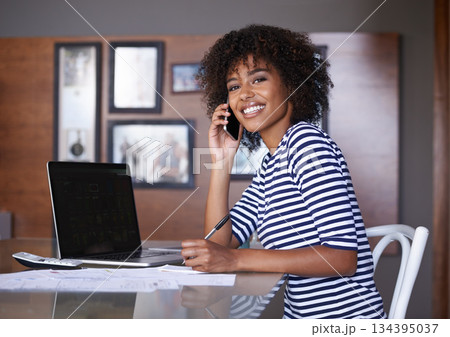Laptop, phone call and woman in portrait of work from home communication, finance advice and productivity at desk. African person talking on cellphone for loan, taxes and writing with computer screen Laptop, phone call and woman in portrait of work from home communication, finance advice and productivity at desk. African person talking on cellphone for loan, taxes and writing with computer screen 134395037