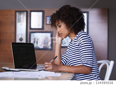 Laptop, writing and woman with work from home budget, financial management and taxes paperwork at desk. Focus, research and calculator of african person on computer screen, notes or finance documents Laptop, writing and woman with work from home budget, financial management and taxes paperwork at desk. Focus, research and calculator of african person on computer screen, notes or finance documents 134395038