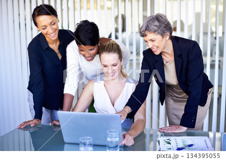 Corporate, collaboration and women with a laptop, teamwork and share ideas at the workplace. Female professionals, employees and workers with happiness, staff and technology for startup development 134395055