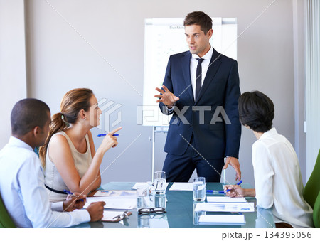 Business man, workshop speaker and meeting of a corporate management team with financial data. Speaking, businessman and collaboration of accounting staff working in a conference room with strategy 134395056